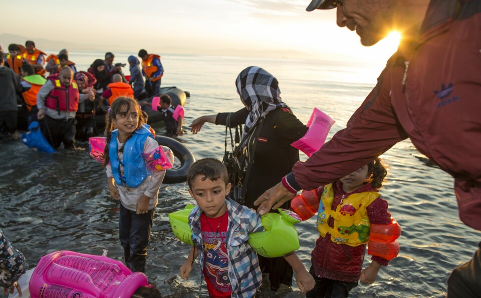 Migranter anländer till den sydöstra ön Kos, Grekland, lördagen den 15 augusti 2015.