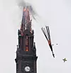 Delar av tornet på den tidigare romers- katolska kyrkan föll av under den dramatiska branden.