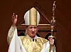 FILE - In this Nov. 18, 2014, file photo, Archbishop Blase Cupich acknowledges after the retiring Cardinal Francis George presents the crozier the during his Installation Mass at Holy Name Cathedral in Chicago. Illinois Attorney General Lisa Madigan on Wednesday, Dec. 19, 2018, issued a blistering report about clergy sexual abuse, saying that Catholic dioceses in Illinois has not released the names of at least 500 clergy accused of sexually abusing children. Cupich in a statement said that although he regretted 'our failures to address the scourge of clerical sexual abuse,' the archdiocese has been a leader in dealing with the issue, including a policy since 2002 of reporting 'all allegations of child sexual abuse to civil authorities.' (AP Photo/Charles Rex Arbogast, Pool, File)