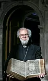The Archbishop of Canterbury Dr Rowan Williams poses for photographers with the 400 year old King James Bible at Lambeth Palace Library's newest exhibition in London, Wednesday, May 25, 2011. Lambeth Palace Library's new exhibition 'Out of the Original Sacred Tongues', which is open until July 29, 2011, celebrates the 400th anniversary of the King James Version. (AP Photo/Akira Suemori)