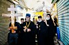 Orthodox Christian worshippers carry crosses during a Good Friday procession as they walk towards the Church of the Holy Sepulcher, where many Christians believe Jesus was crucified, buried and rose from the dead, in Jerusalem's Old City, Friday, April 14, 2023. (AP Photo/Ariel Schalit) ASC102