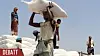 In this Sept. 21, 2018, file photo, men deliver U.N. World Food Programme (WFP) aid in Aslam, Hajjah, Yemen. The World Food Program chief warned Thursday, Sept. 17, 2020, that millions of people are closer to starvation because of the deadly combination of conflict, climate change and the COVID-19 pandemic and he urged donor nations and billionaires to help feed them and ensure their survival. (AP Photo/Hammadi Issa, File) BKWS302